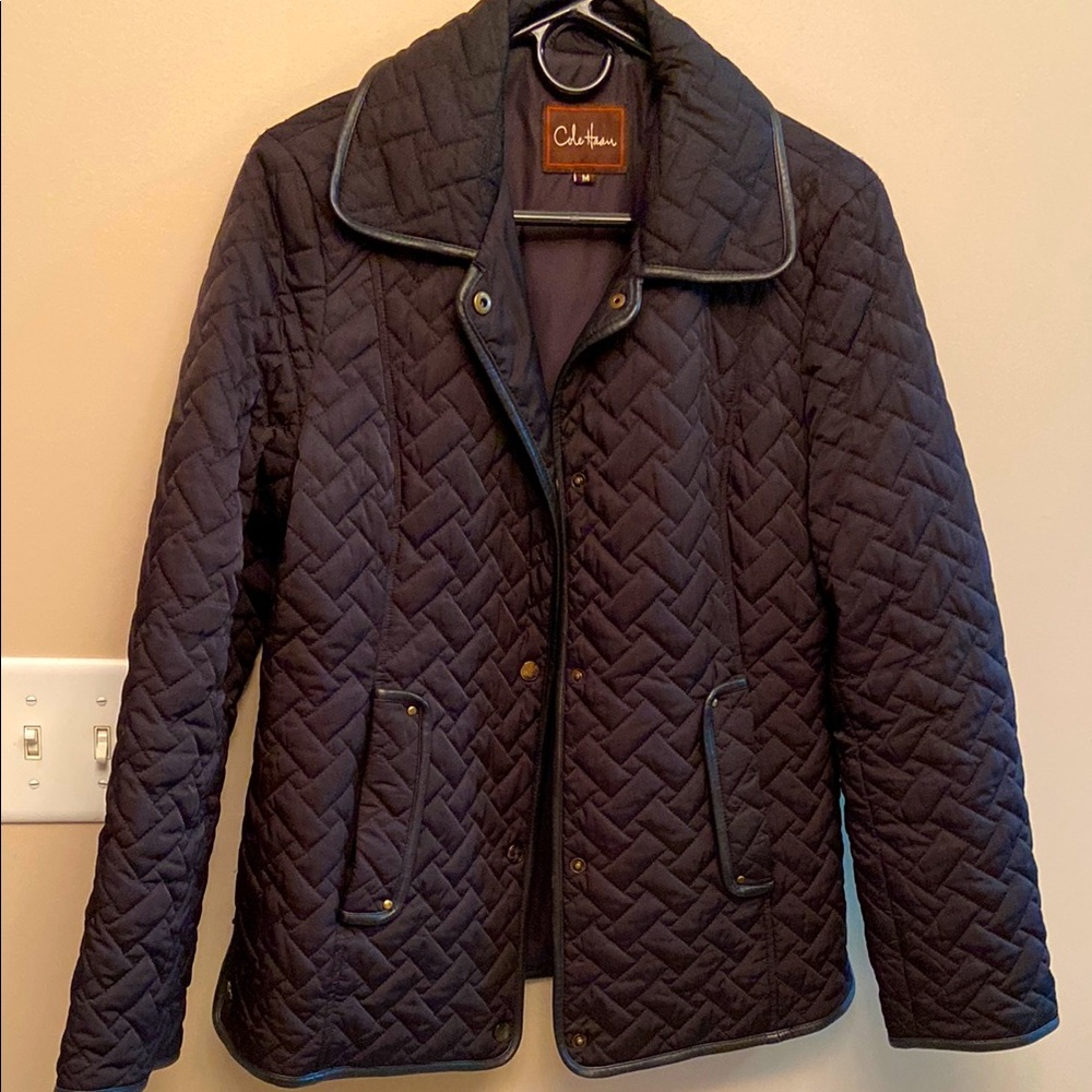 Cole Haan Women’s black quilted coat.  Edged in black leather. Sized Medium
